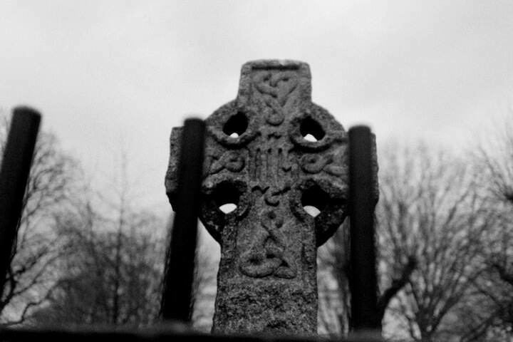 A Celtic cross through fencing.